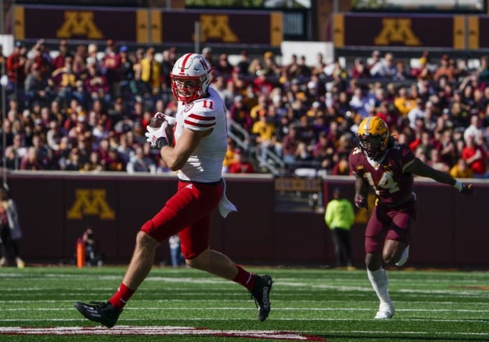 Oct 16, 2021; Minneapolis, Minnesota, USA; Nebraska Cornhuskers tight end Austin Allen (11) runs with the ball after the catch against the Minnesota Golden Gophers during the third quarter at Huntington Bank Stadium.